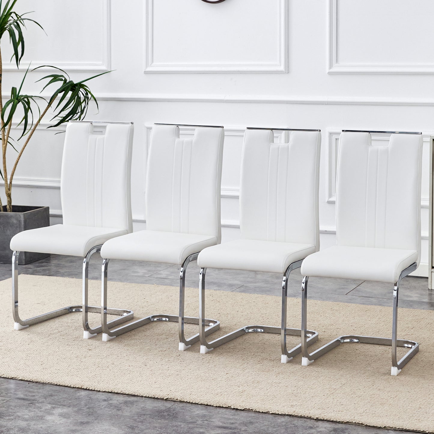 A set of four white PU material bow-shaped chairs - Adding fashion to minimalist and contemporary home styles, with product dimensions of 15.7*20.5*39 inches.