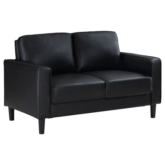 Farallone Black Upholstered Track Arm Loveseat with Smooth Faux Leather, Tapered Feet, and Modern Design - 1st Choice Furniture Direct