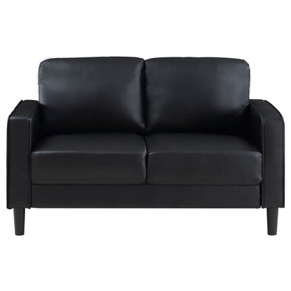 Farallone Black Upholstered Track Arm Loveseat with Smooth Faux Leather, Tapered Feet, and Modern Design - 1st Choice Furniture Direct