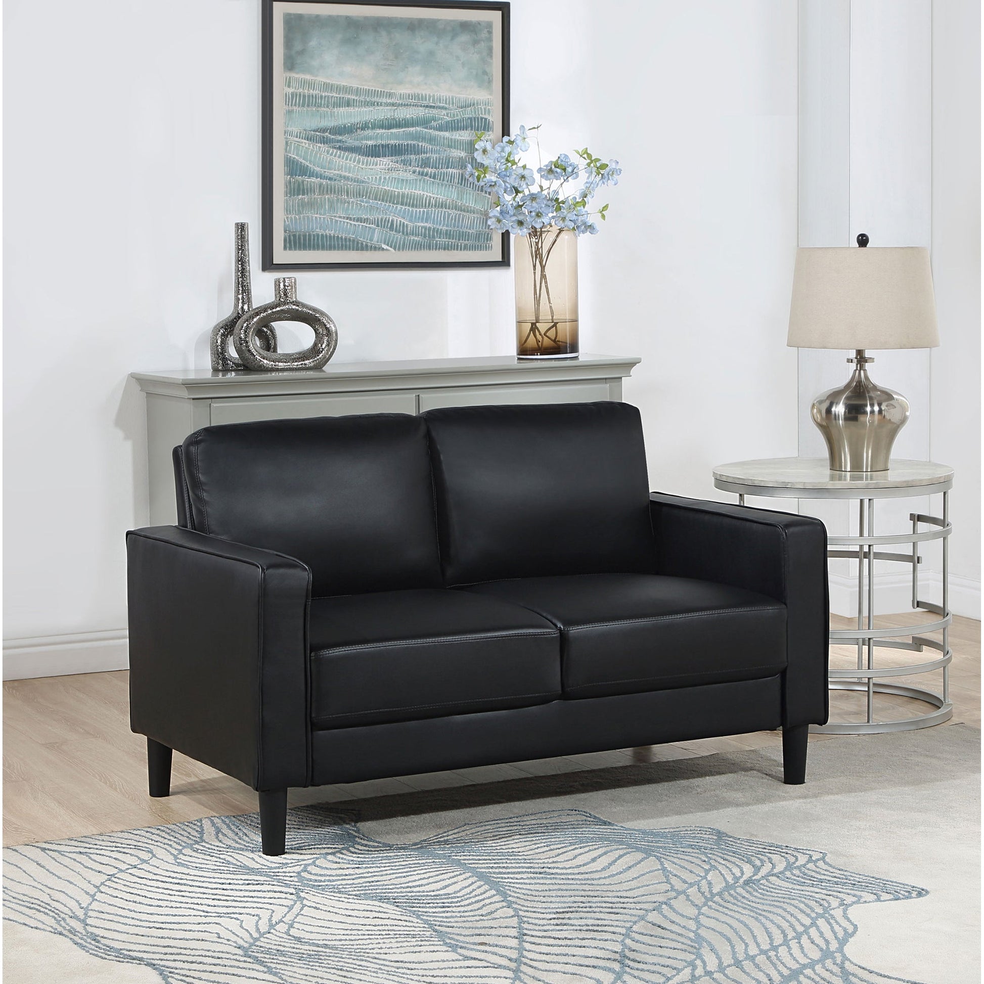 Farallone Black Upholstered Track Arm Loveseat with Smooth Faux Leather, Tapered Feet, and Modern Design - 1st Choice Furniture Direct
